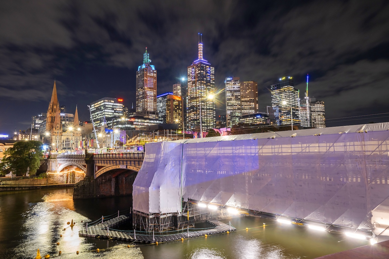 Protected access structure around Princes Bridge above the Yarra at night