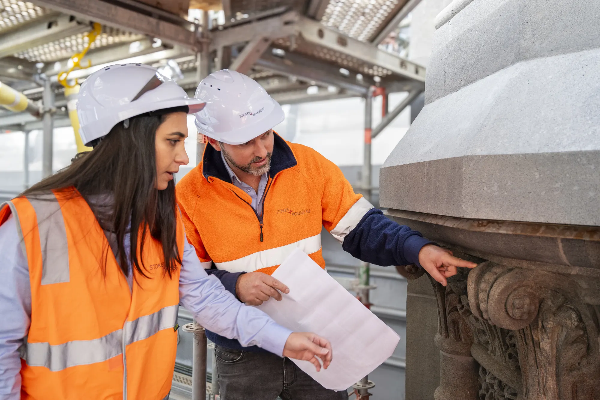 Stokes team members reviewing construction details on site
